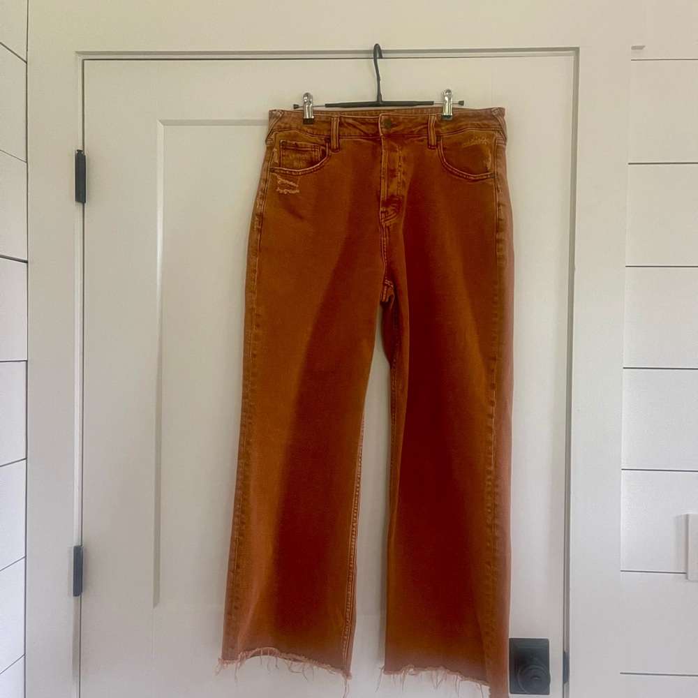 Cleo & Wolf high rise distressed wide leg jeans.